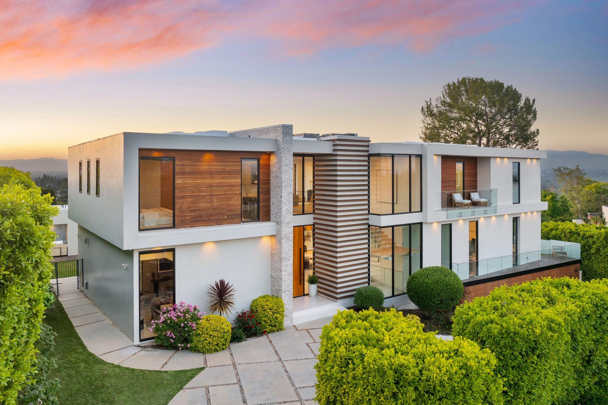 Contemporary hillside home blending with natural surroundings.